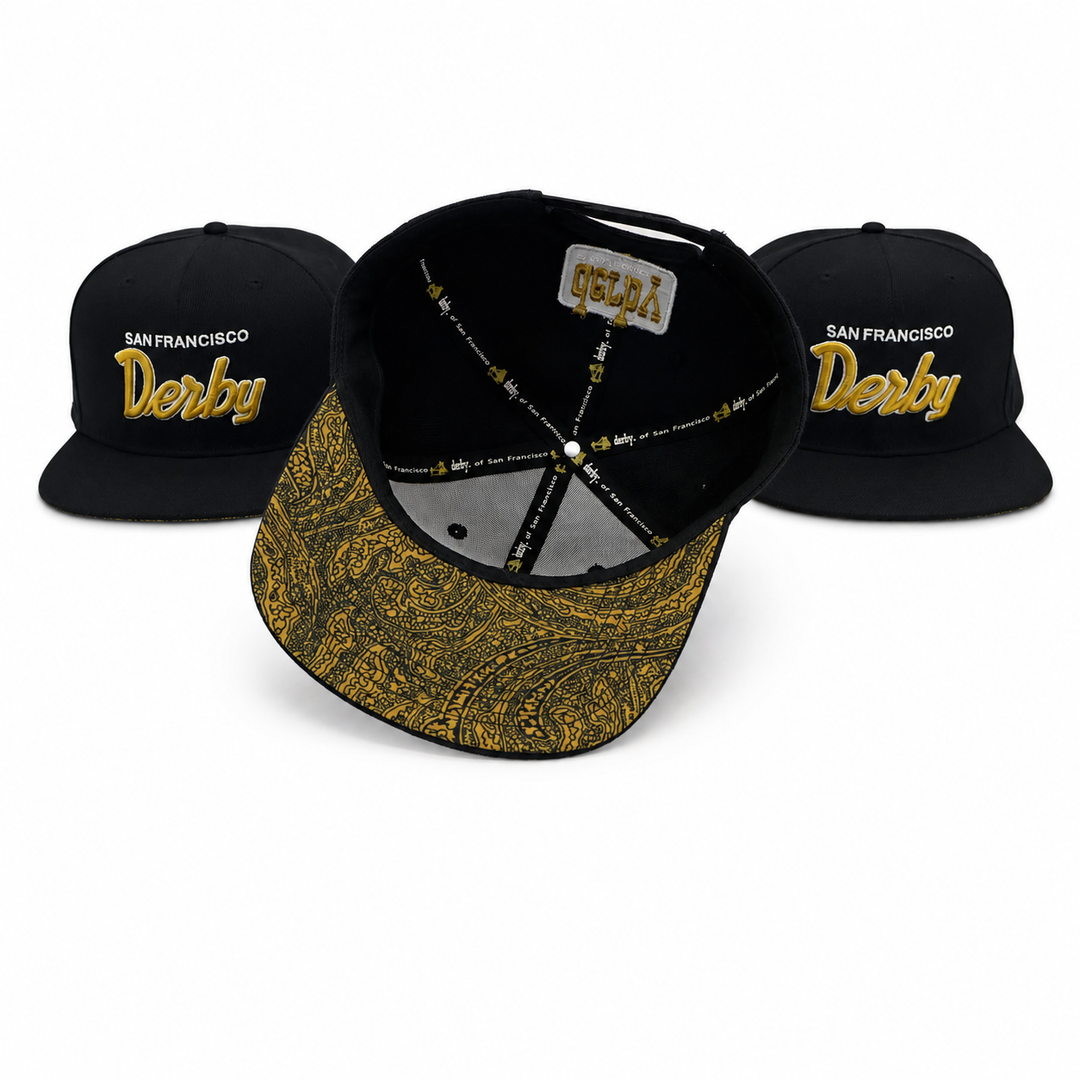Three views of a black snapback cap with gold embroidery reading &