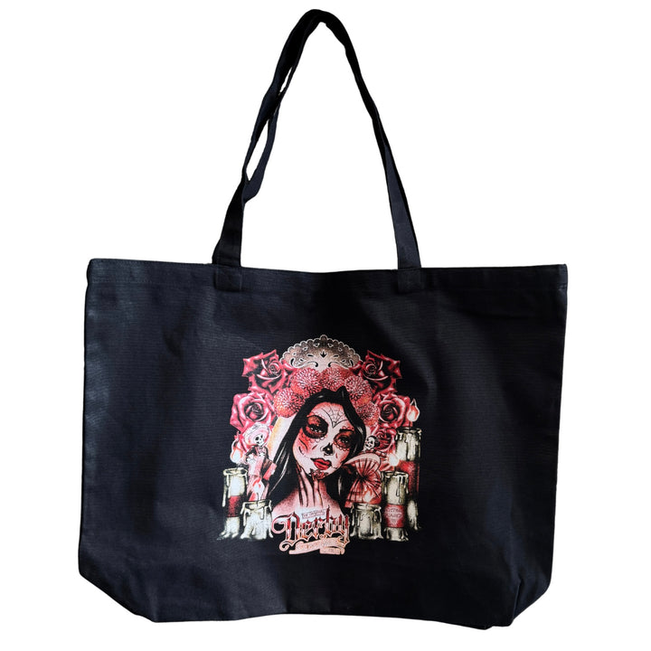 Black tote bag with a colorful design of a woman&